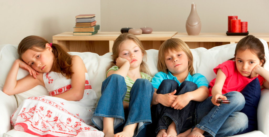 Young Children Watching Television at Home