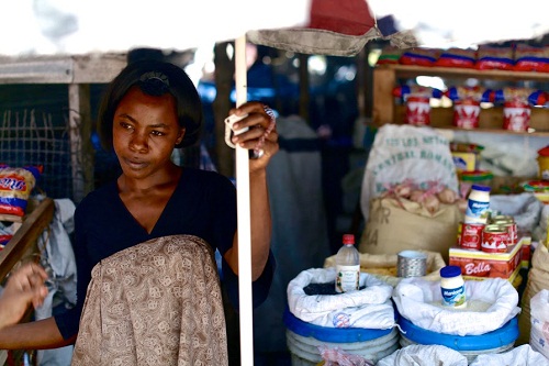 Poverty, Inc._1 ©Mark Waters (Haiti. Enersa Market Woman)